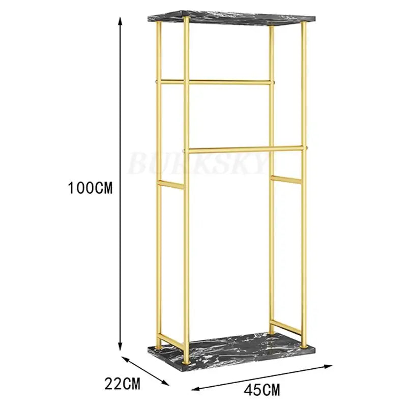 Porte serviette sur pieds en métal doré avec étagère